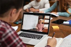 Woman takes class online with live instructor