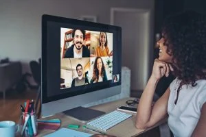 Woman networking with others over Zoom.